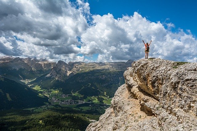 person on the top of the hill